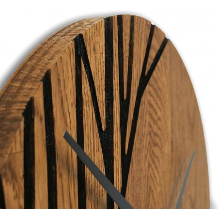 Wooden wall clock with black hands and a modern pattern.