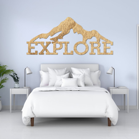 Carved wood image of a mountain - EXPLORE