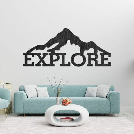 Carved wood image of a mountain - EXPLORE