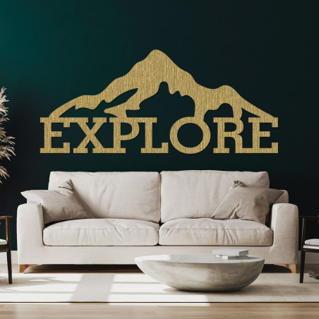 Carved wood image of a mountain - EXPLORE