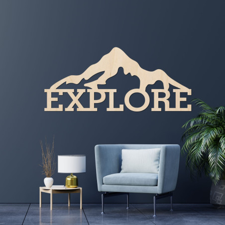 Carved wood image of a mountain - EXPLORE