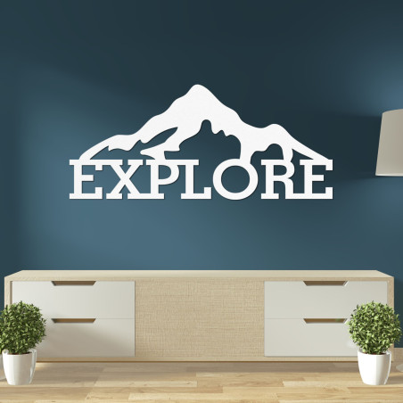 Carved wood image of a mountain - EXPLORE