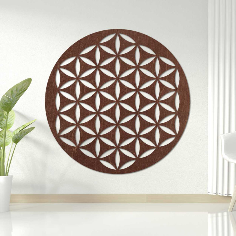 Wooden wall decoration with a geometric flower of life pattern displayed on a light wall.