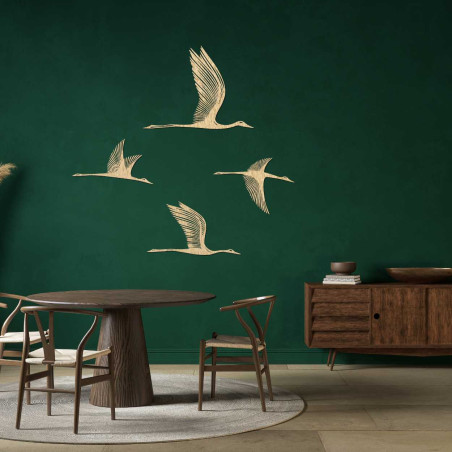 Wooden wall decoration with four flying birds in a minimalist style