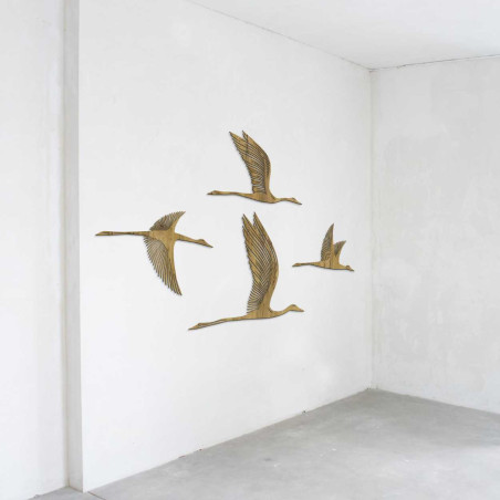 Wooden motif of four birds flying to the right