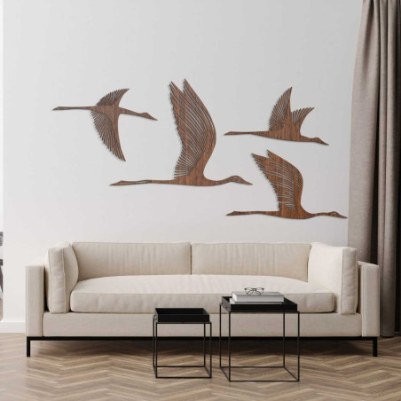 Detailed silhouette of birds in flight carved from quality wood