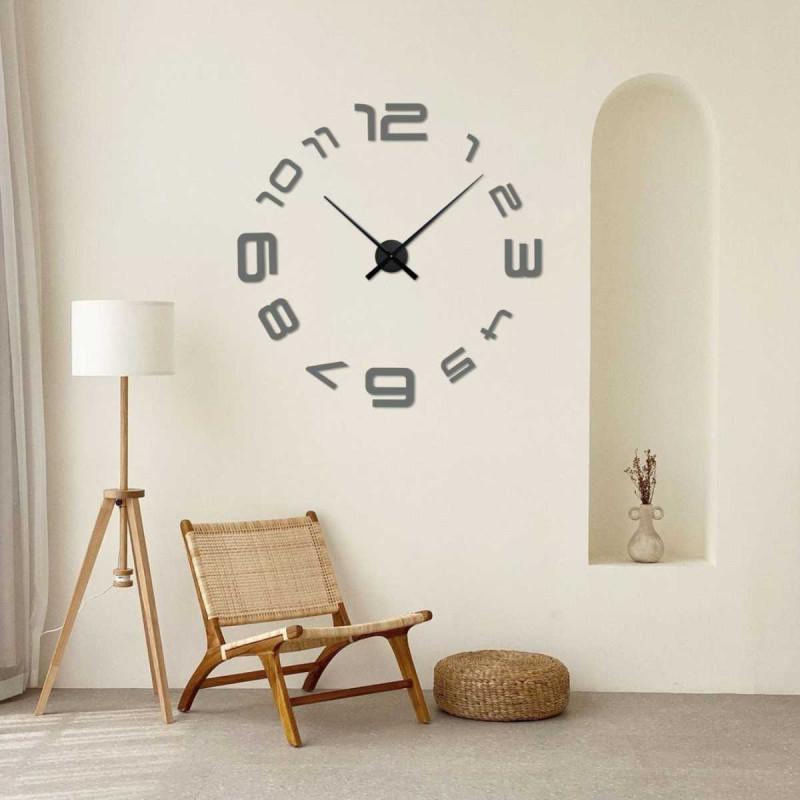 A wall clock with a simple arrangement of numbers and an elegant center point.