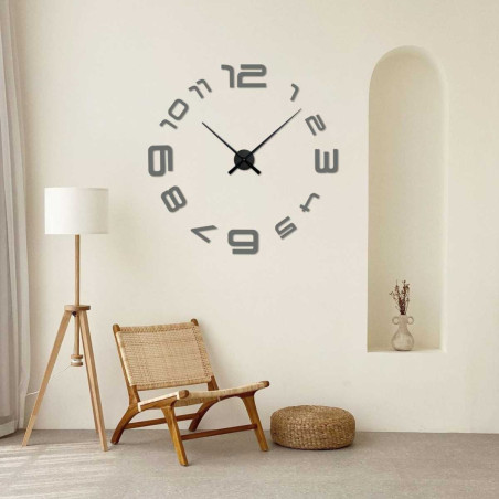 A wall clock with a simple arrangement of numbers and an elegant center point.