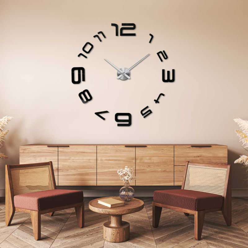 Detail of a sticker clock with a delicate design and thin hands.