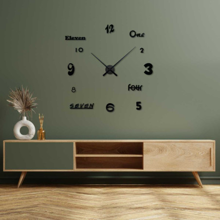 Modern adhesive wall clock with colorful numerals on the dial.