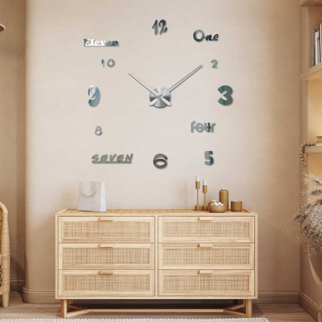 Wall clock with distinctive hands and a dial with a combination of numbers and words.