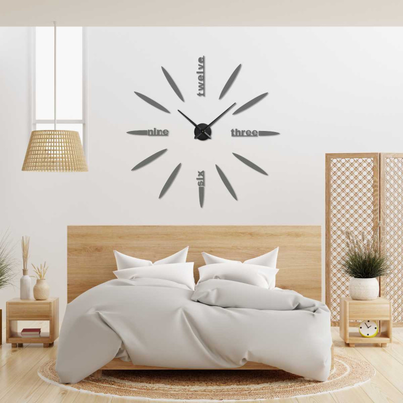 Detail of a 3D clock with a modern dial, oval elements and legible word inscriptions.