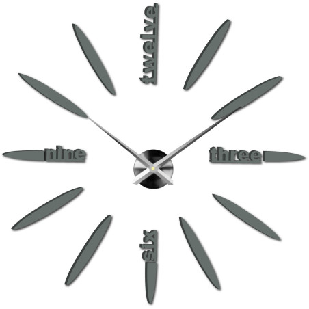 Modern 3D wall clock with inscriptions instead of numbers and a minimalist design.