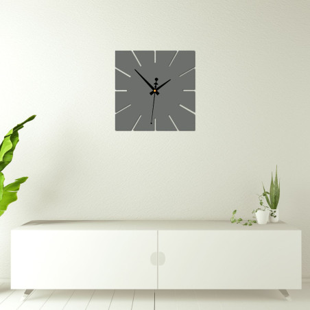 A clock with a strong contrast between the background and the hands