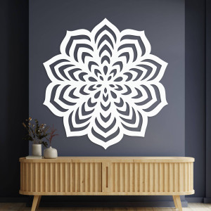 Wooden decoration with an elaborate circular shape and delicate cutouts.