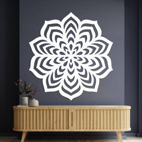 Wooden decoration with an elaborate circular shape and delicate cutouts.