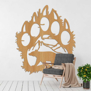 A close-up view of a natural motif of a bear and mountains inside a large wooden paw. 2