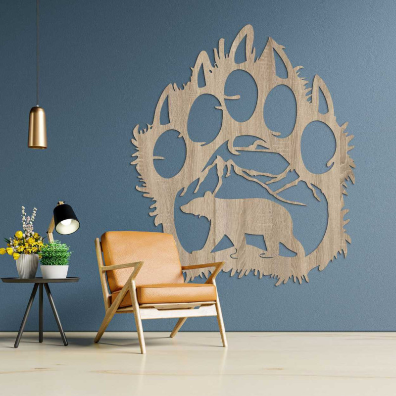 A carved nature motif enclosed in the dramatic silhouette of a bear's paw.