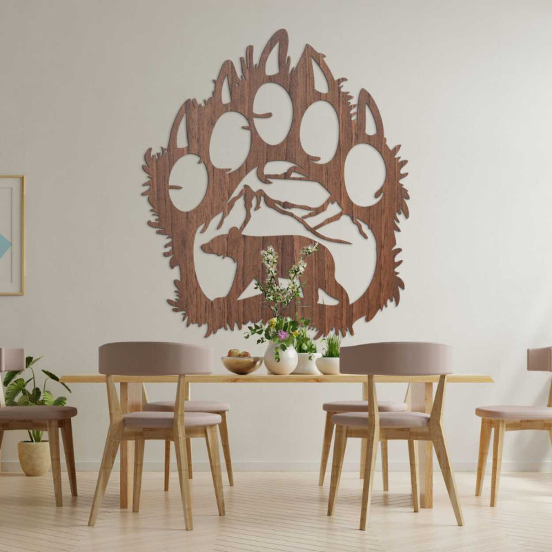 Decoration with a silhouette of a bear and mountains, hand-carved into natural wood.