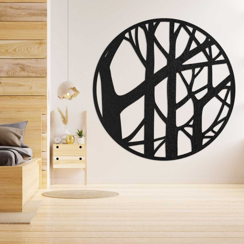 Design circle made of wood with a branch pattern on a dark wall