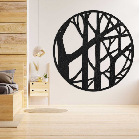 Design circle made of wood with a branch pattern on a dark wall