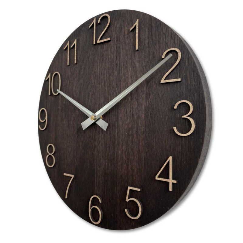 Wooden wall clock with carved numbers and metal hands.