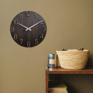 Wooden wall clock with carved numbers and metal hands. 2