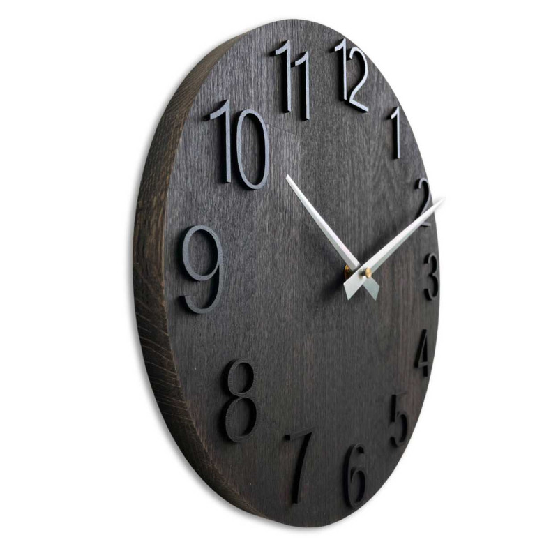 A wooden decorative element in the shape of a clock with carved numbers and a clean style.