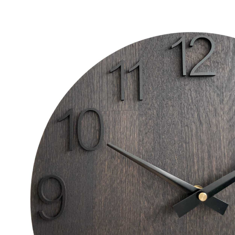 Round clock made of wood with a subtle, natural look.