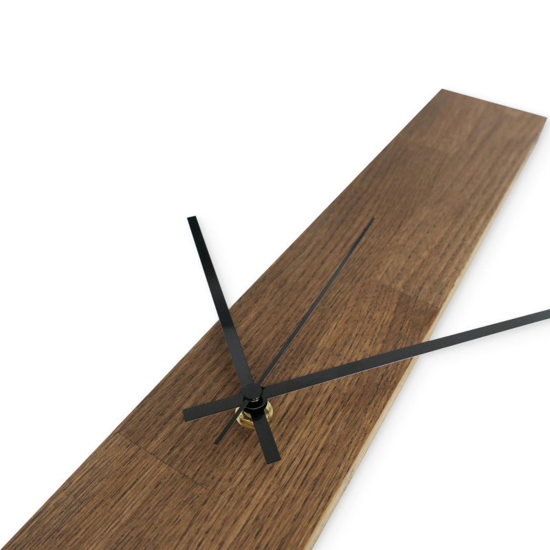 Black wooden wall clock with a soft matte finish.