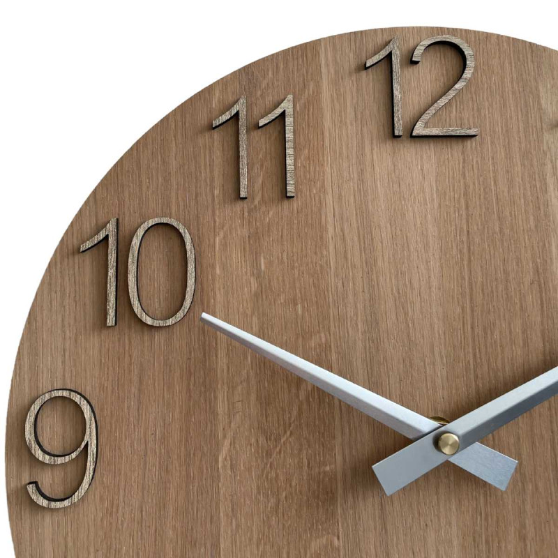Wooden wall clock with visible material structure and smooth surface.
