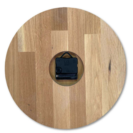 Natural wooden clock with a simple design and thin hands. Natural wooden clock with a simple design and thin hands.