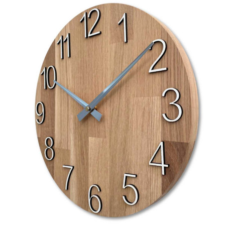Natural wooden clock with a simple design and thin hands. Natural wooden clock with a simple design and thin hands.