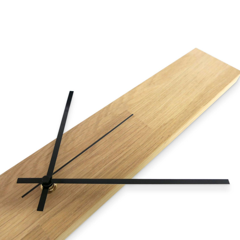 Wooden clock with a natural finish, with clever black hands to display the time.