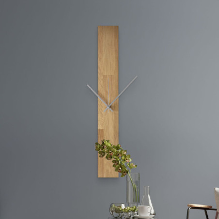 Wall clock made of textured wood with minimalist black hands and no numbers.