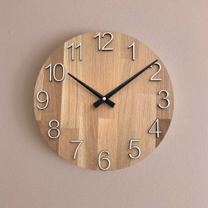 Wooden wall clock with visible material structure and smooth surface. 2