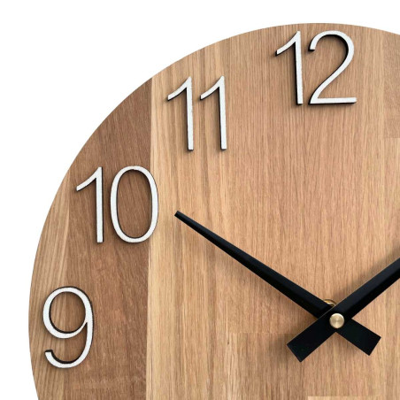 A shot of a clock face made of wood with a clean and simple look.