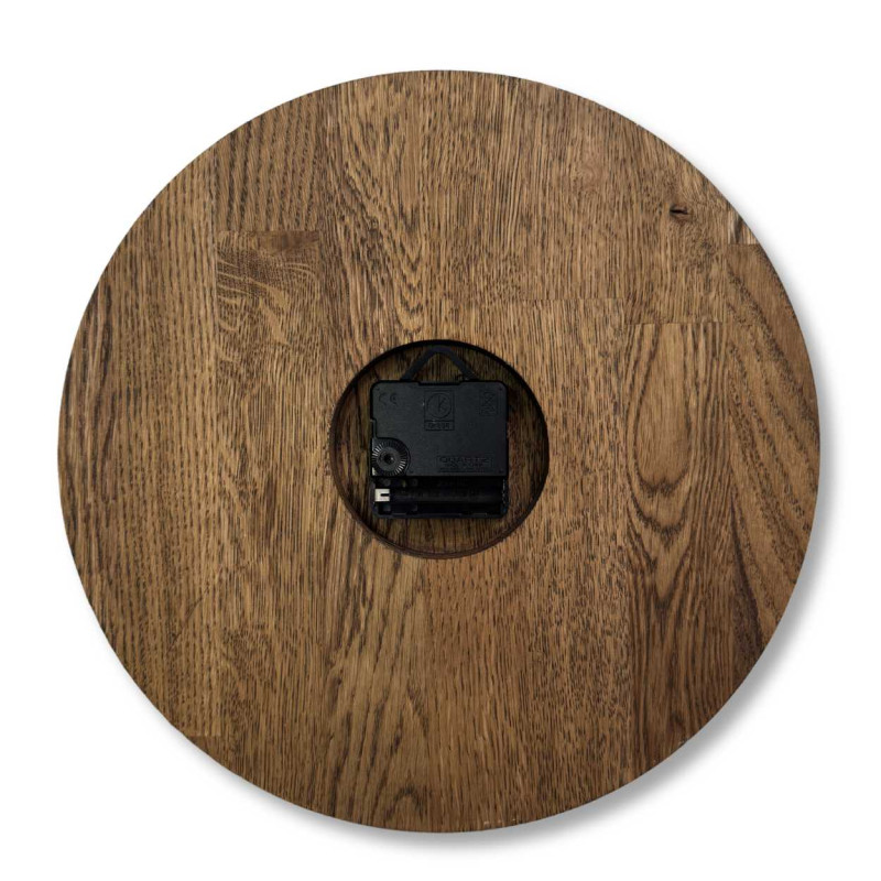 Wooden wall clock with a circular shape and a subtle natural motif.