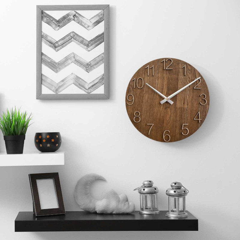 Carved wooden clock with a simple dial and minimalist design.