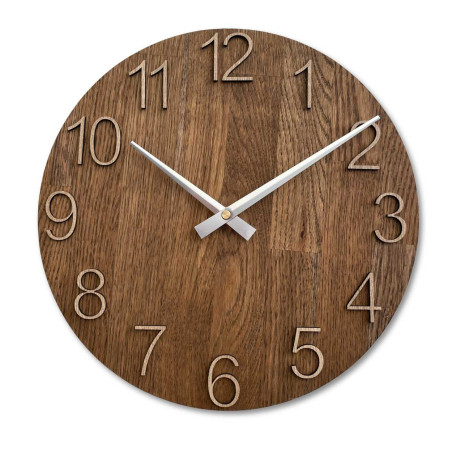 Clock made of solid wood with engraved numbers and a natural pattern.