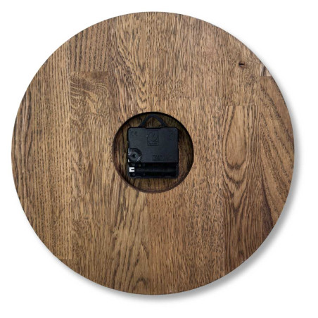 Wooden wall clock with a circular shape and a subtle natural motif.
