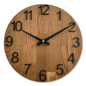 Wooden wall clock with a circular shape and a subtle natural motif.
