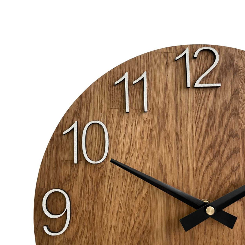 Natural wooden clock with a simple design and thin hands.