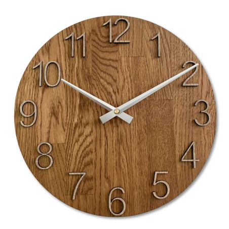 Natural wooden clock with a simple design and thin hands. Natural wooden clock with a simple design and thin hands.