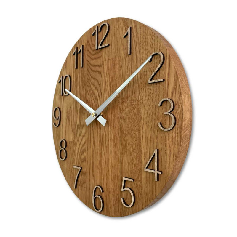 Wooden wall clock with a circular shape and a subtle natural motif.