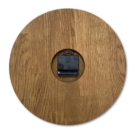Carved wooden clock with a simple dial and minimalist design. Carved wooden clock with a simple dial and minimalist design.