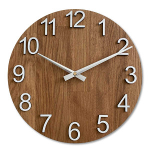 Wooden wall clock with a circular shape and a subtle natural motif.