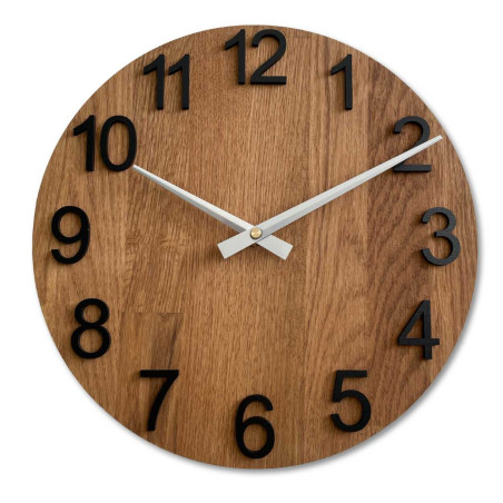 Wooden wall clock with visible material structure and smooth surface.