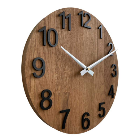 Round clock with a decorative cutout in the center and a delicate wood pattern.