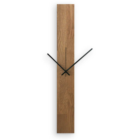 A clock made of natural wood with a distinctive pattern and contrasting silver and black hands. A clock made of natural wood with a distinctive pattern and contrasting silver and black hands.